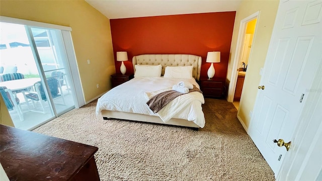 bedroom with access to exterior, carpet, and vaulted ceiling