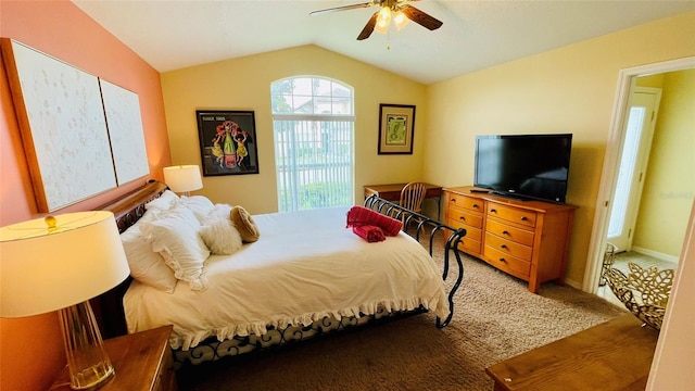 bedroom featuring hardwood / wood-style flooring, lofted ceiling, and ceiling fan