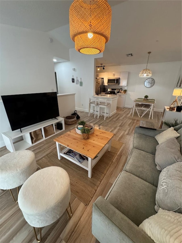 living room featuring light wood-type flooring