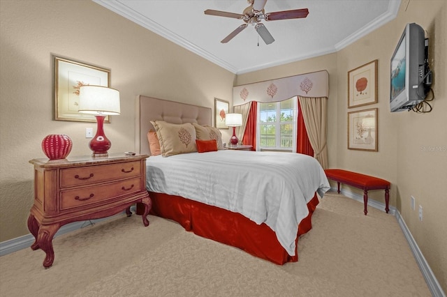 carpeted bedroom with ceiling fan and crown molding