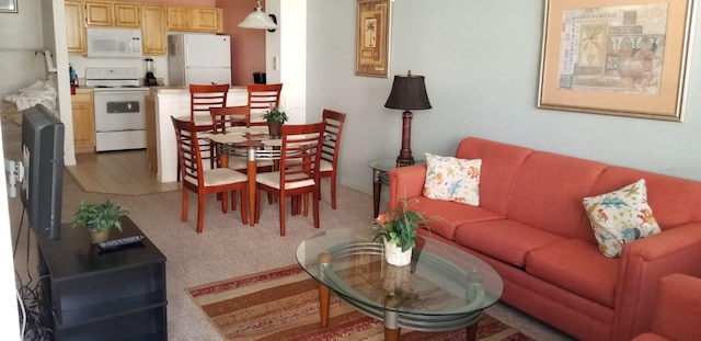 living room featuring light carpet