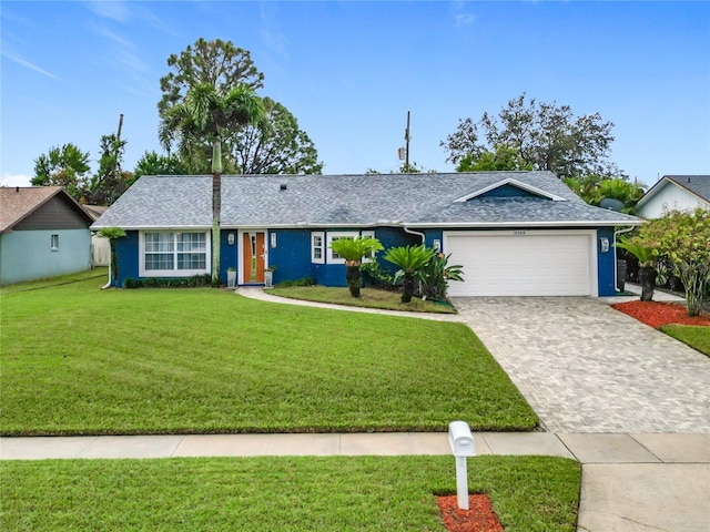 ranch-style house with a front yard and a garage