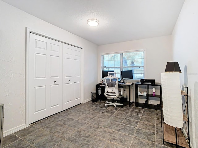 office area with a textured ceiling