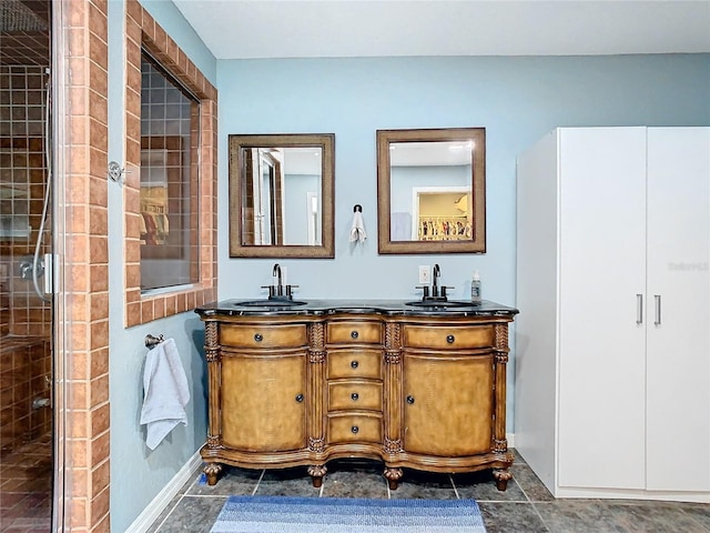 bathroom featuring vanity and a shower with shower door