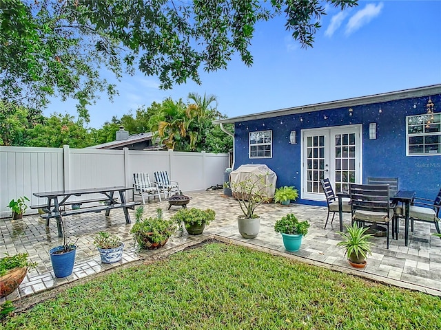 view of yard with french doors and a patio area