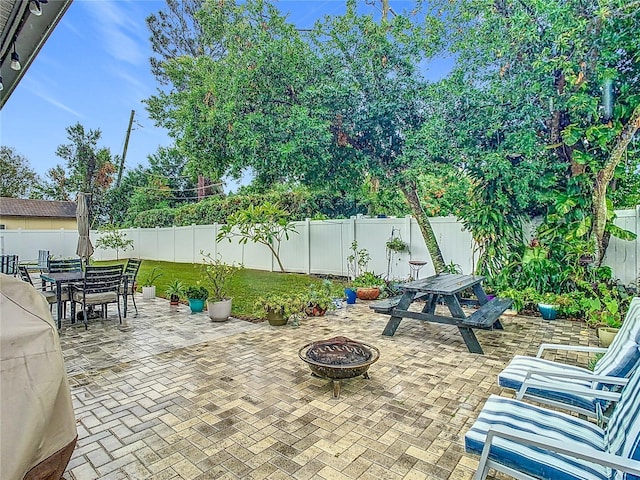 view of patio / terrace featuring a fire pit