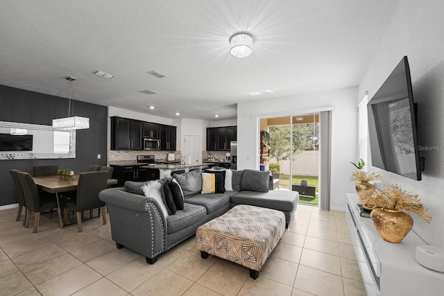 tiled living room with a textured ceiling