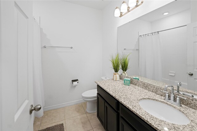 15109 Willow Arbor Cir, Orlando, FL 32824 - full bathroom featuring vanity, toilet, a shower with shower curtain, tile patterned floors, and baseboards