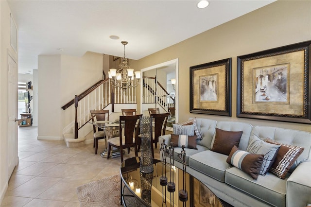 living room with a notable chandelier and light tile patterned floors