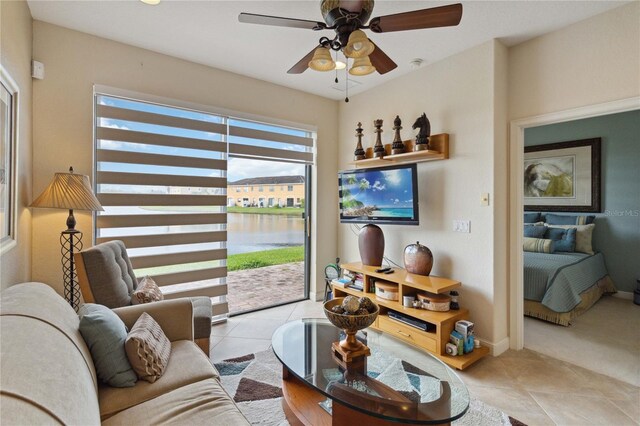 tiled living room with ceiling fan