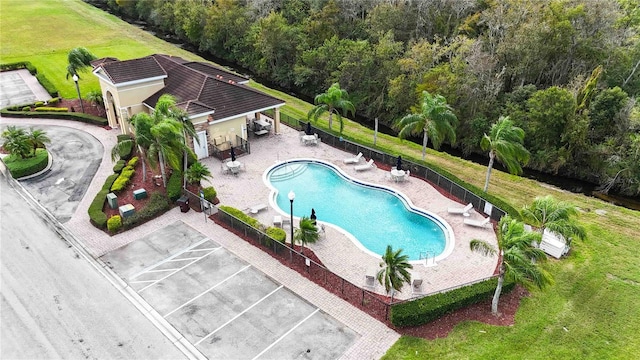 view of pool with a yard and a patio area