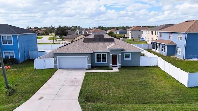 view of front facade with a garage and a front lawn