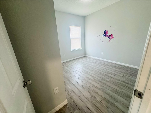 spare room with light wood-type flooring