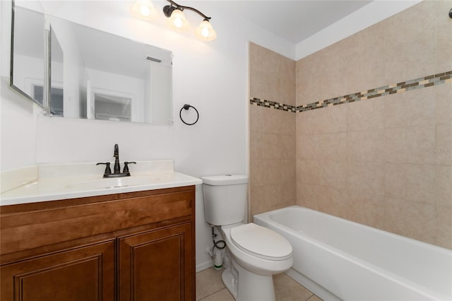 full bathroom featuring vanity, toilet, tiled shower / bath combo, and tile patterned floors