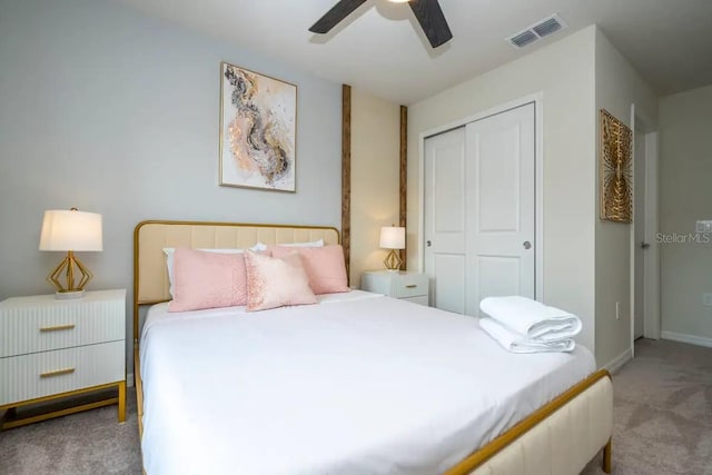 bedroom with light carpet, ceiling fan, and a closet