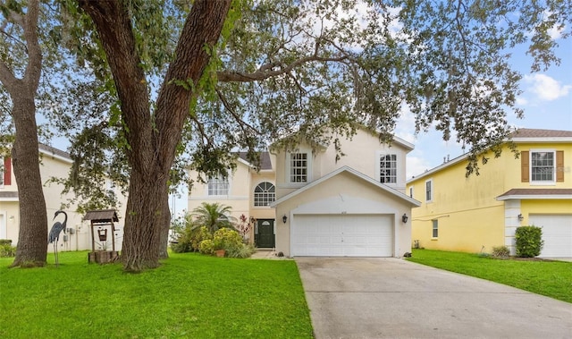 view of front of home with a garage and a front yard