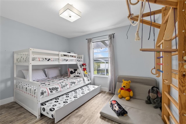 bedroom with hardwood / wood-style floors