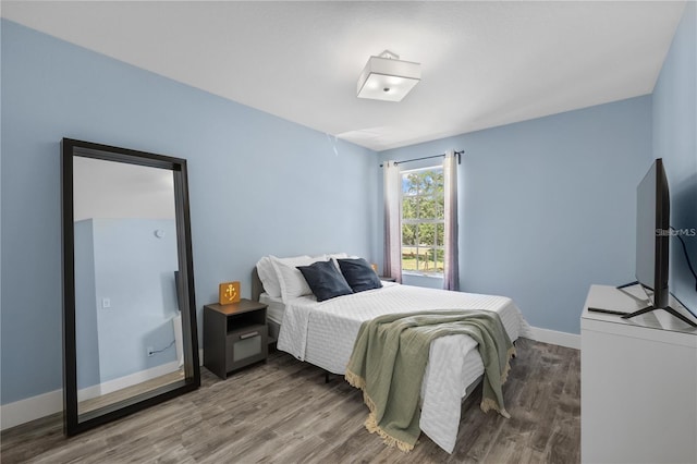 bedroom featuring hardwood / wood-style floors