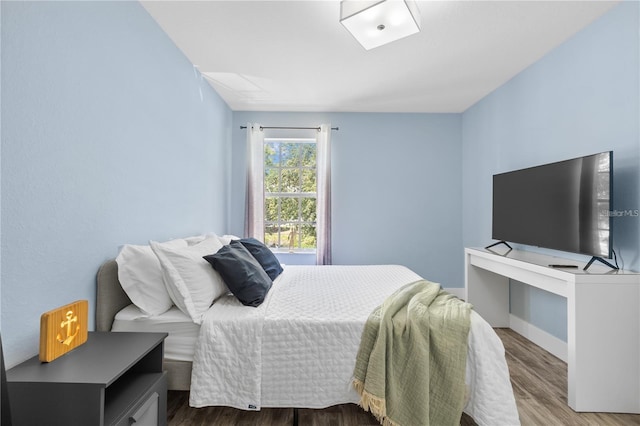 bedroom with wood-type flooring