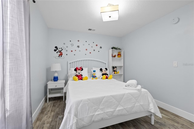 bedroom featuring dark hardwood / wood-style floors