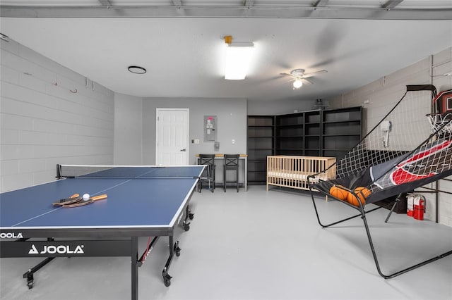 recreation room with concrete flooring and ceiling fan