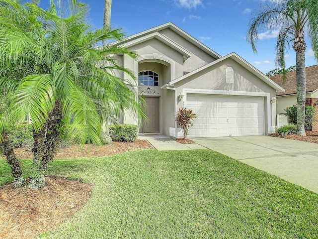 view of front of home featuring a front yard and a garage