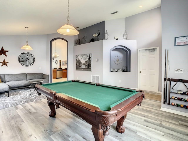 playroom featuring high vaulted ceiling, light hardwood / wood-style floors, and billiards