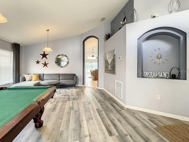 recreation room with hardwood / wood-style floors, billiards, and vaulted ceiling