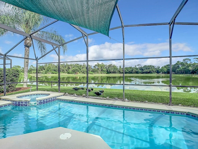 view of pool with a lanai, an in ground hot tub, and a water view