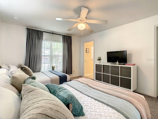 bedroom with light carpet and ceiling fan