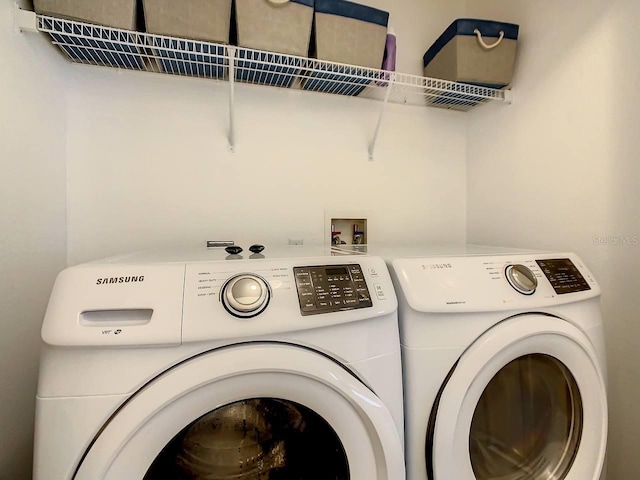 washroom featuring washer and clothes dryer