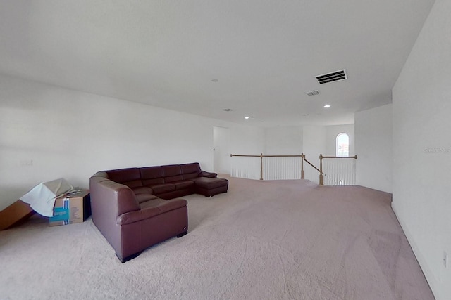 living room featuring light carpet