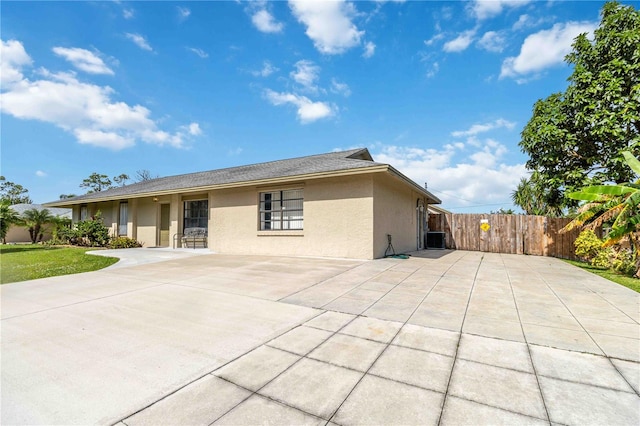 exterior space with central AC unit and a patio area