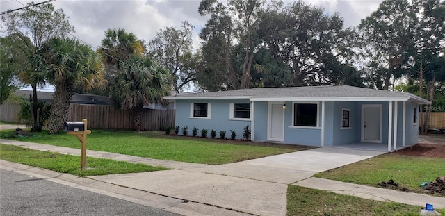 ranch-style home with a front lawn