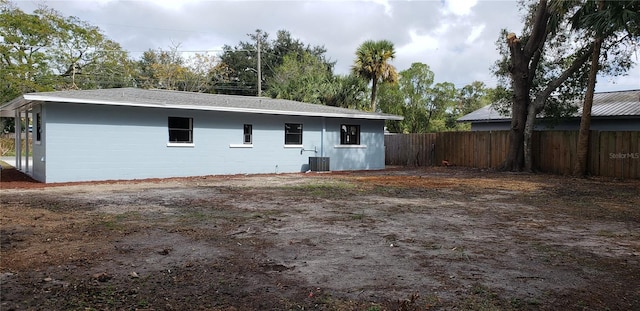 back of property featuring central air condition unit