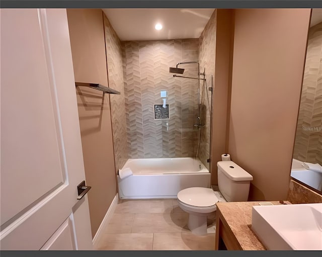 full bathroom with vanity, toilet, tiled shower / bath, and tile patterned floors