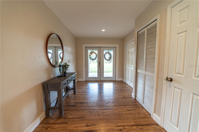 4121 Albritton Rd, Saint Cloud, FL 34772 - entrance foyer with french doors, wood finished floors, baseboards, a textured wall, and recessed lighting