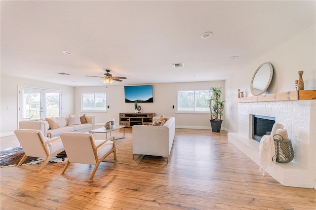 4121 Albritton Rd, Saint Cloud, FL 34772 - living area with light wood finished floors, a fireplace, a ceiling fan, baseboards, and recessed lighting