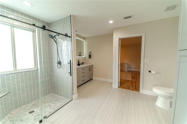4121 Albritton Rd, Saint Cloud, FL 34772 - full bath featuring a shower stall, vanity, toilet, recessed lighting, and baseboards