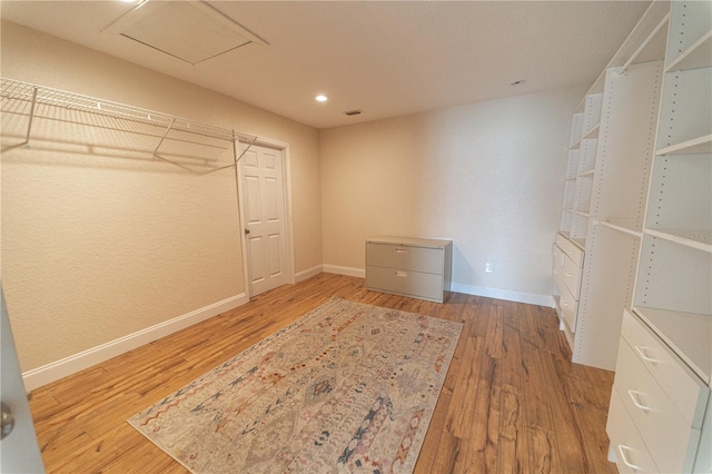 walk in closet featuring hardwood / wood-style floors