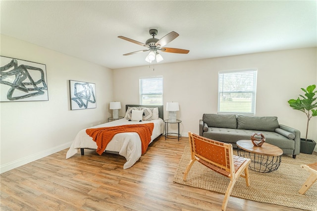 bedroom featuring ceiling fan and light wood-type flooring