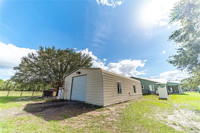 exterior space with a yard and a garage