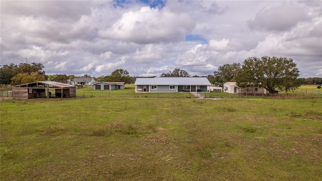 4121 Albritton Rd, Saint Cloud, FL 34772 - back of house featuring an outbuilding