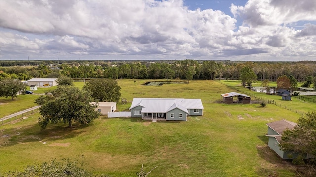 birds eye view of property featuring a rural view