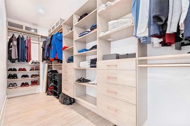 spacious closet featuring light hardwood / wood-style flooring