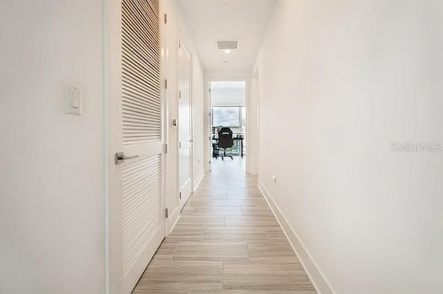 hallway featuring light wood-type flooring