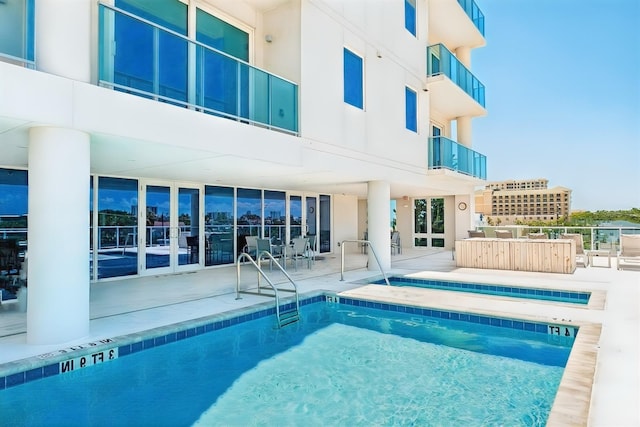 view of swimming pool with a patio