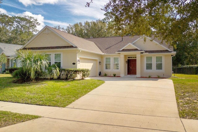 view of front facade with a garage and a front lawn