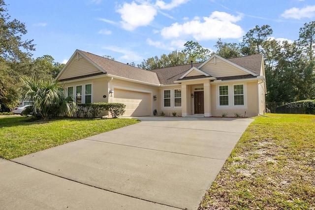 view of front of property with a garage and a front lawn