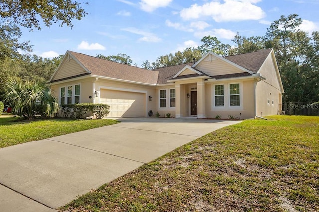 view of front of property featuring a front yard and a garage